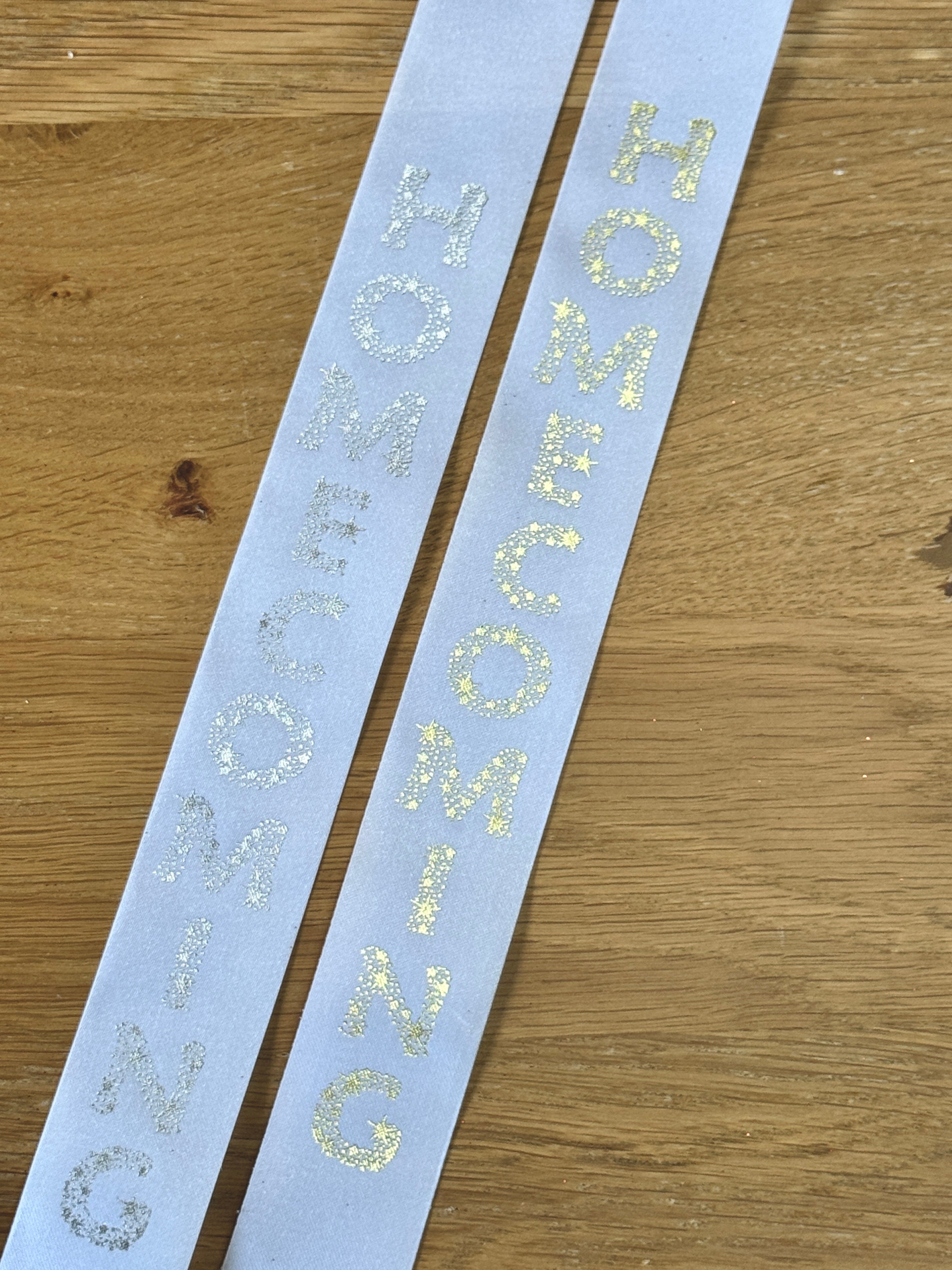Homecoming Imprint Ribbon – #9 White Acetate Ribbon with Foil Stamped Gold or Silver Letters (Sold by the Yard)